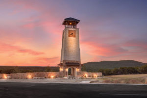 Stone clock tower in the sunset at Tessera
