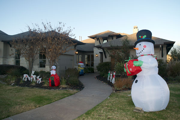 New home in Lago Vista with Christmas decorations in the yard.
