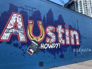 Building graffiti in Austin welcoming people to the city.