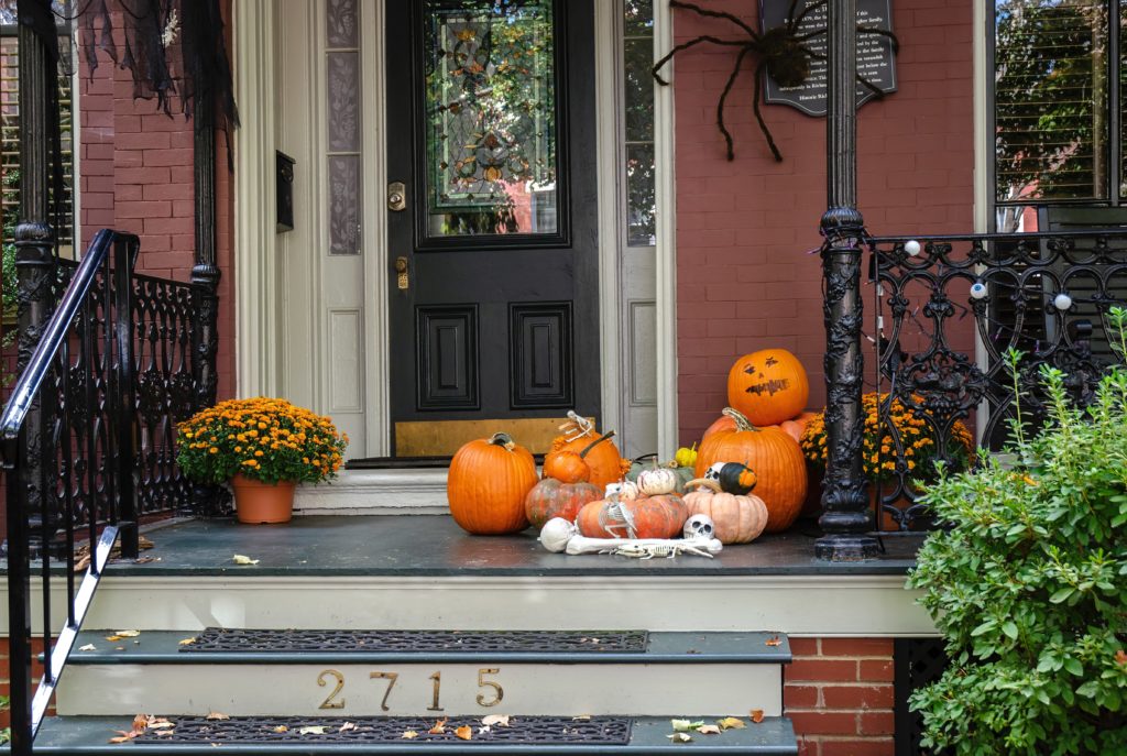 Fall home decor on a front porch.