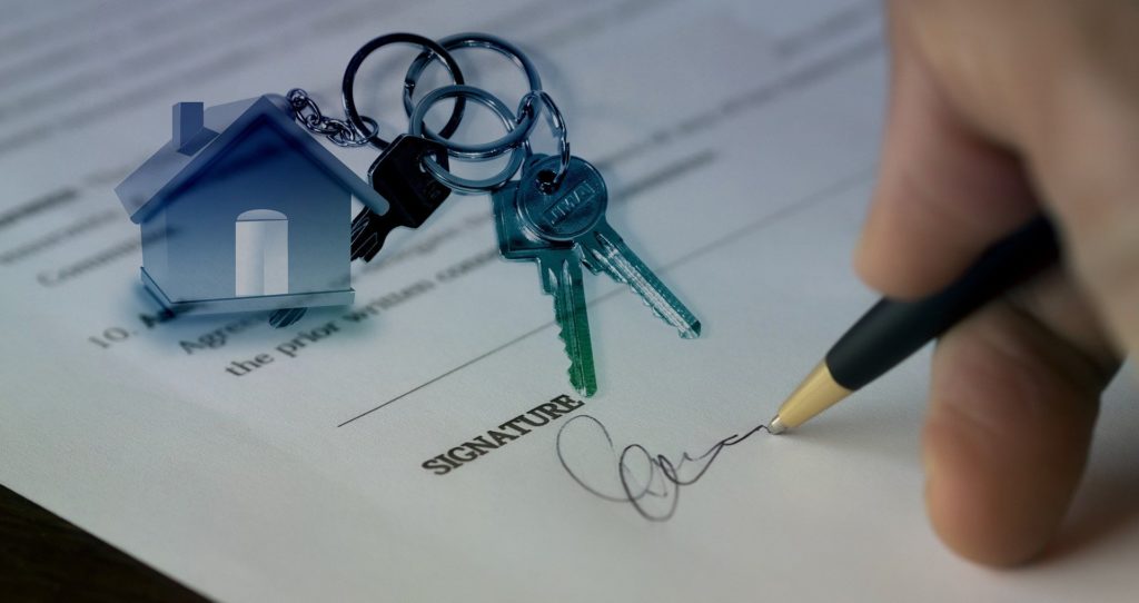 Signing Document to Buy House