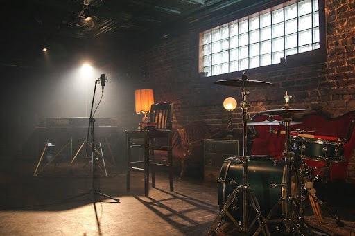 band set up with drums, keyboard, and microphone in a bar in Austin, Texas