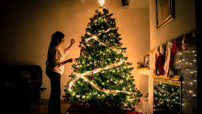 a woman decorating Christmas tree in Austin Texas